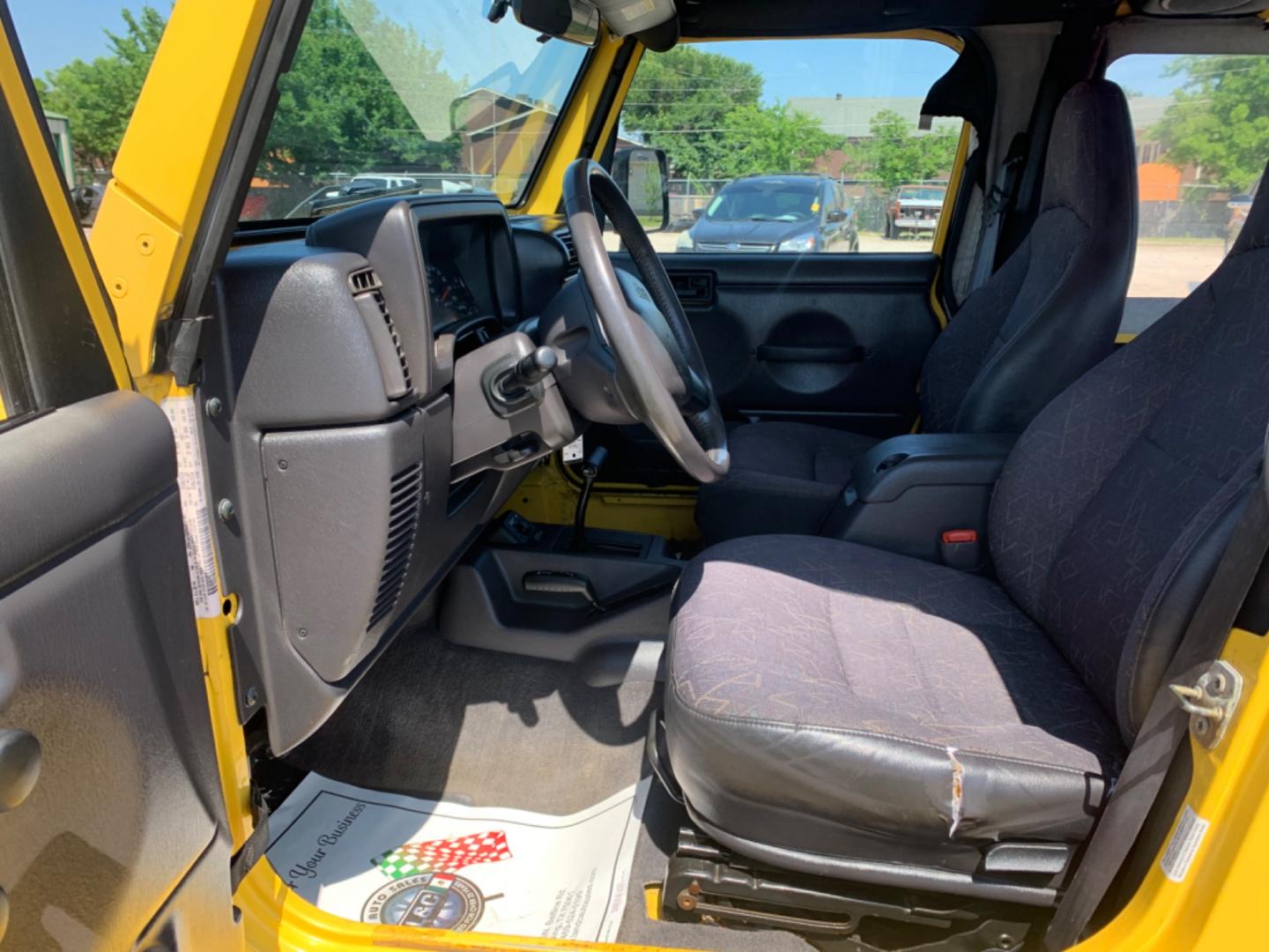 2001 Yellow /Black Jeep Wrangler WRANGLER (1J4FA49S81P) with an 6 Cylinders S 4.0L FI OHV 242 CID engine, AUTOMATIC transmission, located at 1830 North Belt Line Road, Irving, TX, 75061, (469) 524-0199, 32.834373, -96.993584 - Photo#8